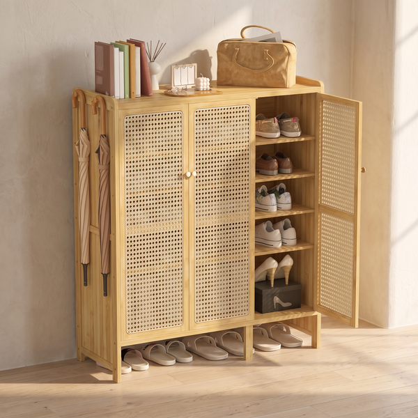 Hakone bamboo cane cabinet against a pale plaster wall on oak floorboards