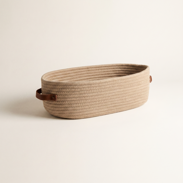 Helsinki oval woven rope basket with stitched handle tabs, studio shot