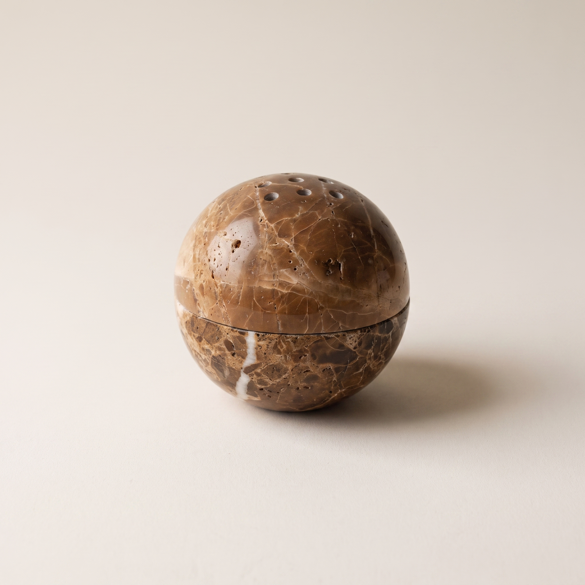 Kanazawa travertine stone sphere incense burner, studio shot