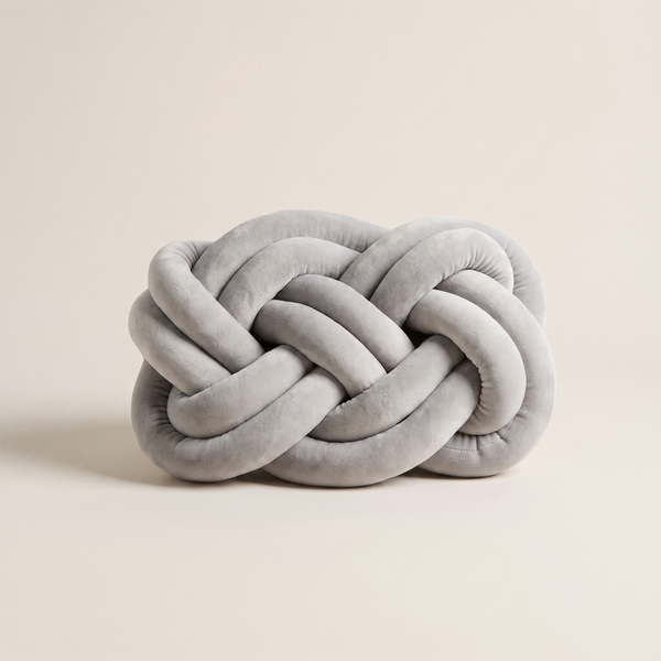 Oslo braided knot cushion in light grey, studio shot
