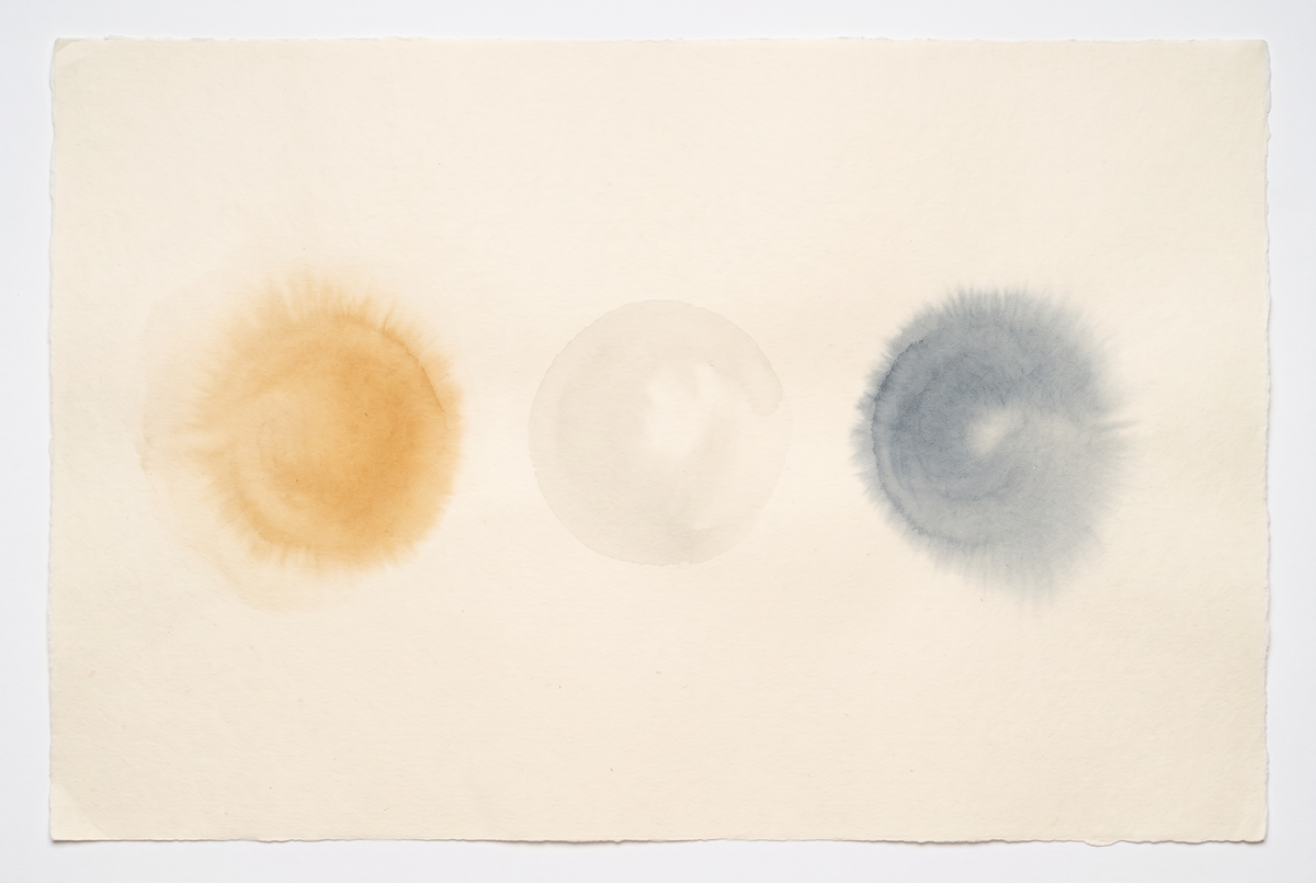 Ink wash study of three pools of light on a wall, one warm, one neutral and one cool