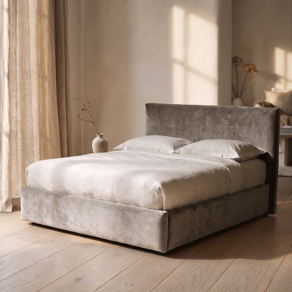 Gothenburg ottoman bed dressed in white linen in a pale plaster bedroom