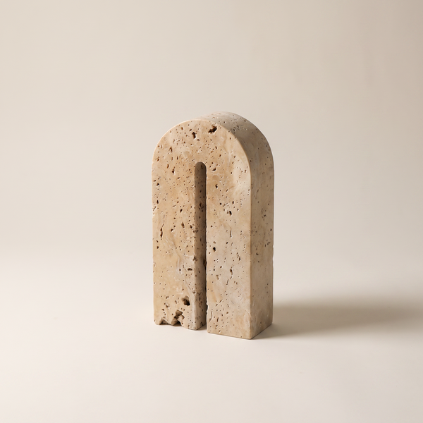 Milan travertine arch book holder with a vertical slot, studio shot