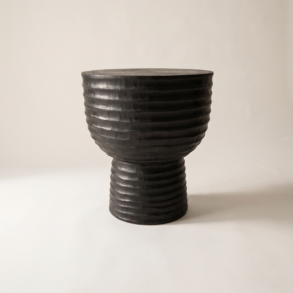 Nara charcoal stool with ribbed carved rings, studio shot